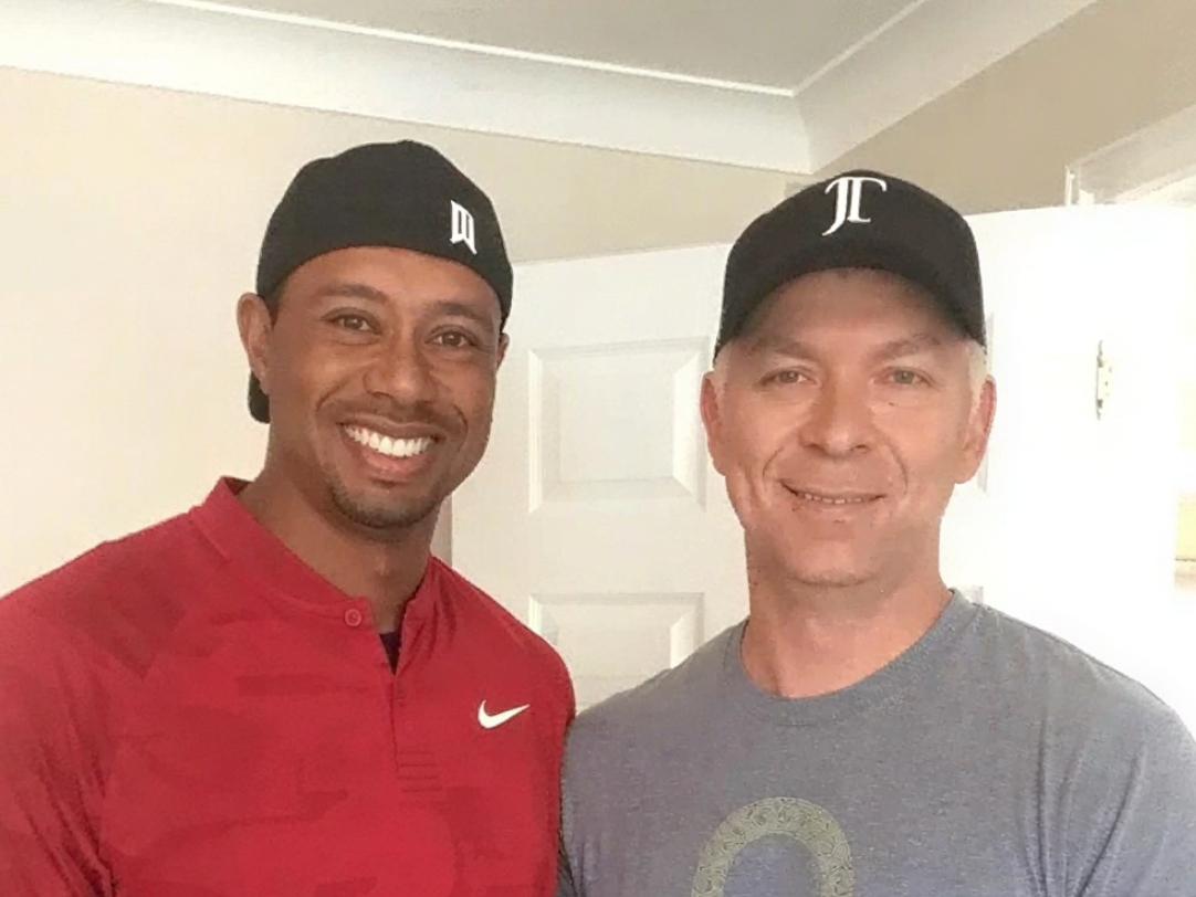Dr. Troy Van Biezen working with Tiger Woods
